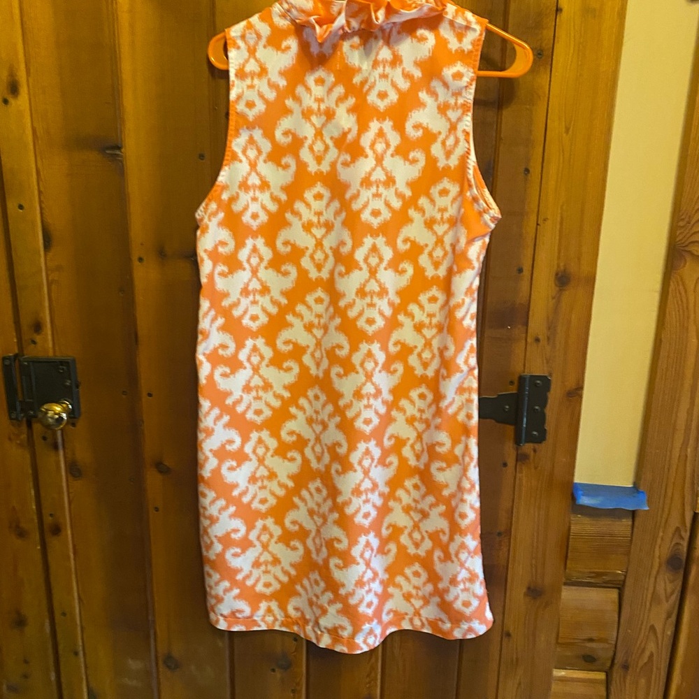 Breezy, lightweight, looks orange in pictures but the real color is more salmon